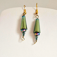 These handmade haematite earrings are artfully crafted to resemble delicate Christmas trees, offering a subtle festive touch that’s stylish enough to wear all year round. The rich, metallic sheen of green haematite pairs beautifully with gold-plated copper findings, creating an elegant balance of sparkle and sophistication. Lightweight, versatile, and thoughtfully designed, they’re perfect for adding a unique charm to any outfit at any time of the year.