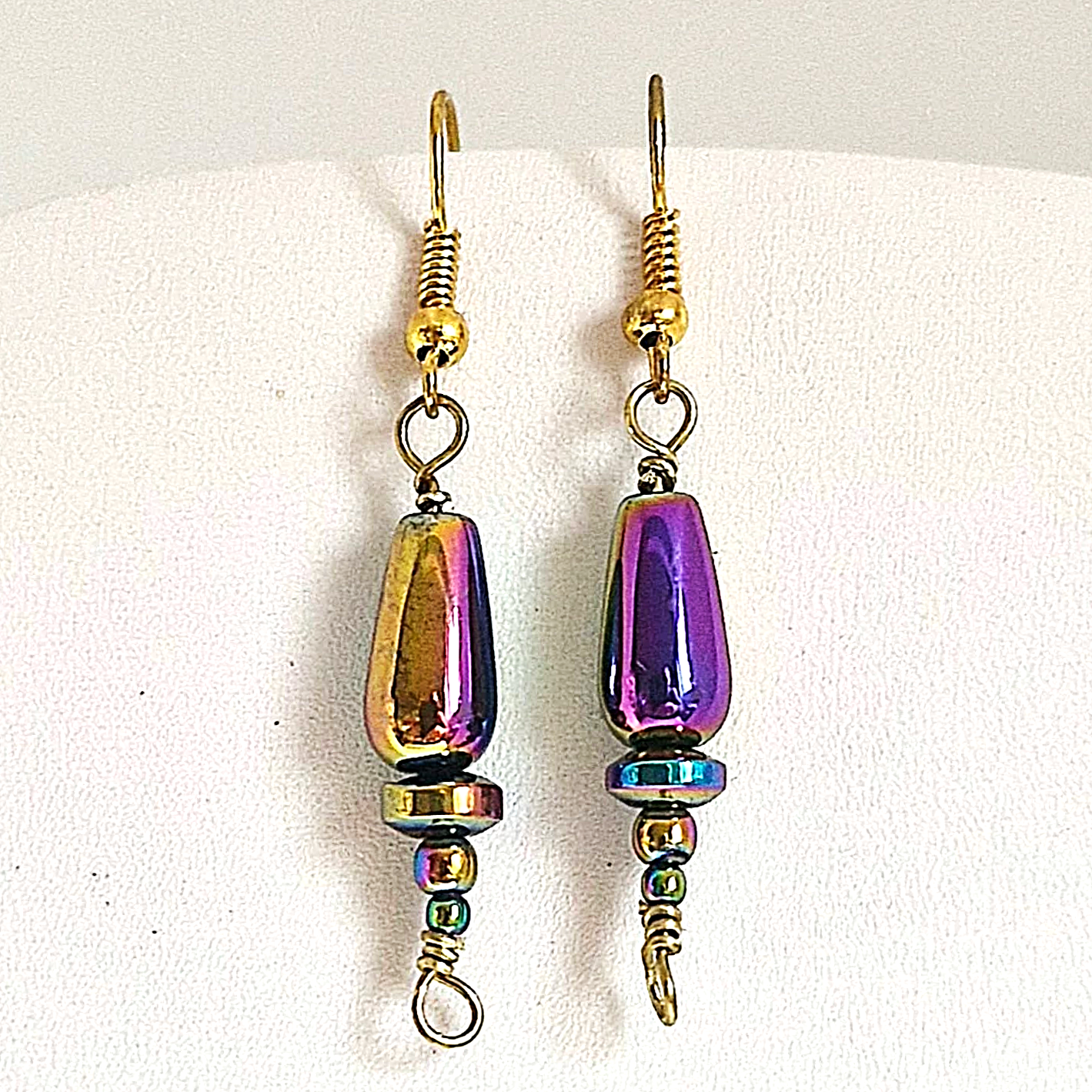 These handmade haematite earrings are artfully crafted to resemble delicate Christmas trees, offering a subtle festive touch that’s stylish enough to wear all year round. The rich, metallic sheen of rainbow haematite pairs beautifully with gold-plated copper findings, creating an elegant balance of sparkle and sophistication. Lightweight, versatile, and thoughtfully designed, they’re perfect for adding a unique charm to any outfit at any time of the year.