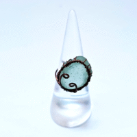 Cradled in reclaimed copper, this green sea glass carries the quiet mystery of its ocean journey. The copper’s own story intertwines with the glass, creating a unique ring that celebrates time, transformation, and beauty.